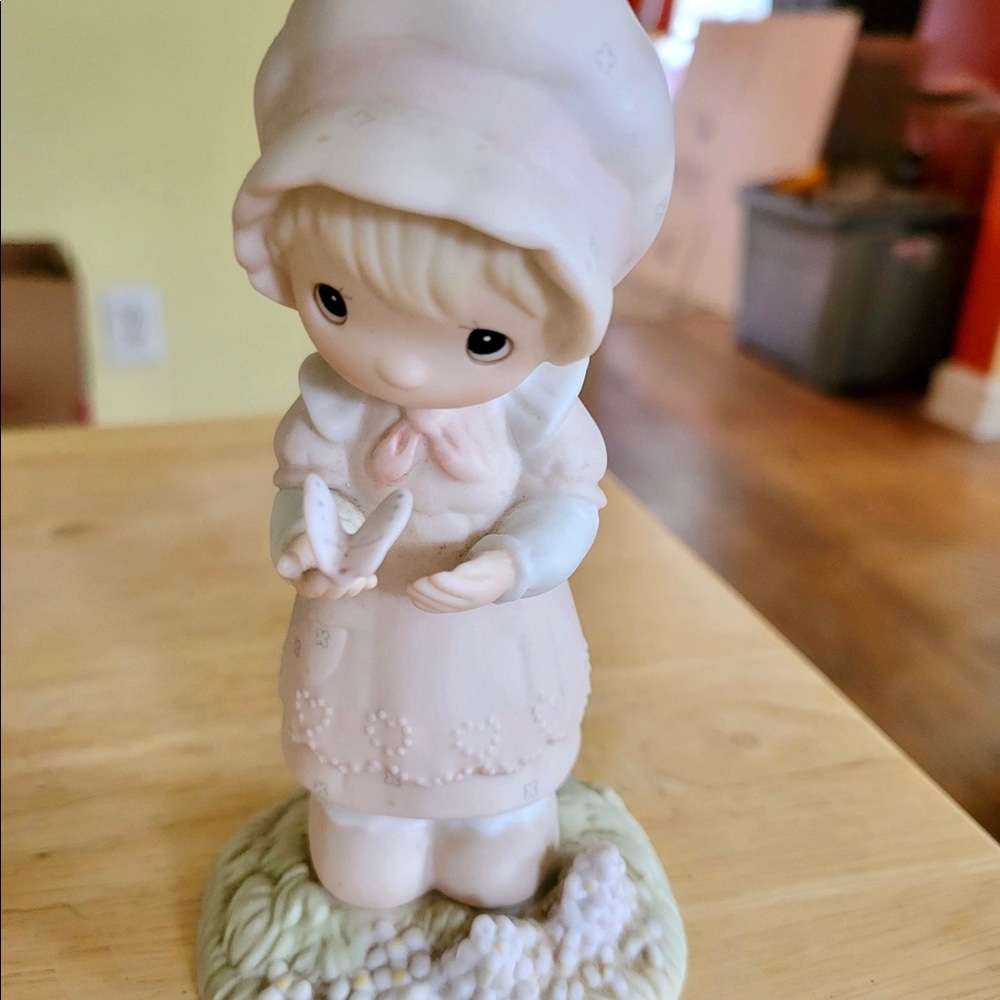 Precious Moments little girl with butterfly